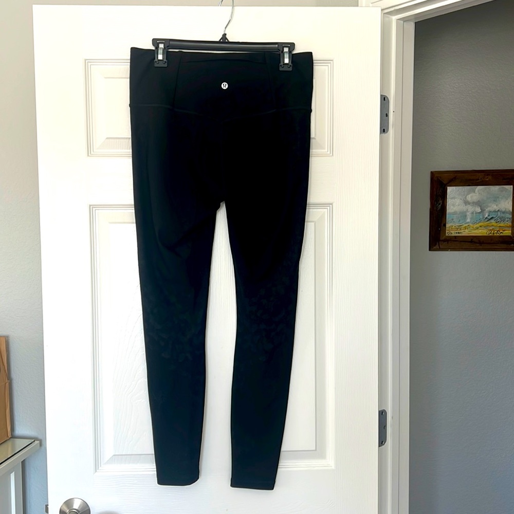 Lululemon leggings. Black with leopard print on legs. Size 12. 28” length.
